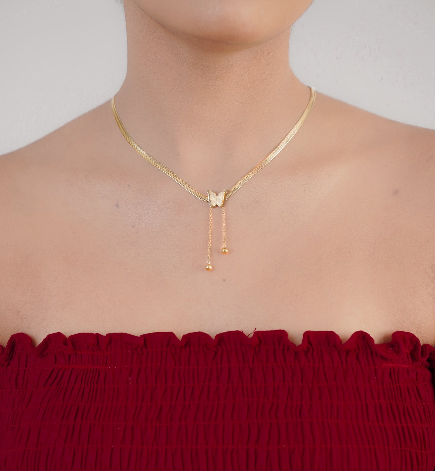 Baroque butterfly necklace styled with red dress – Luxteno Sri Lanka