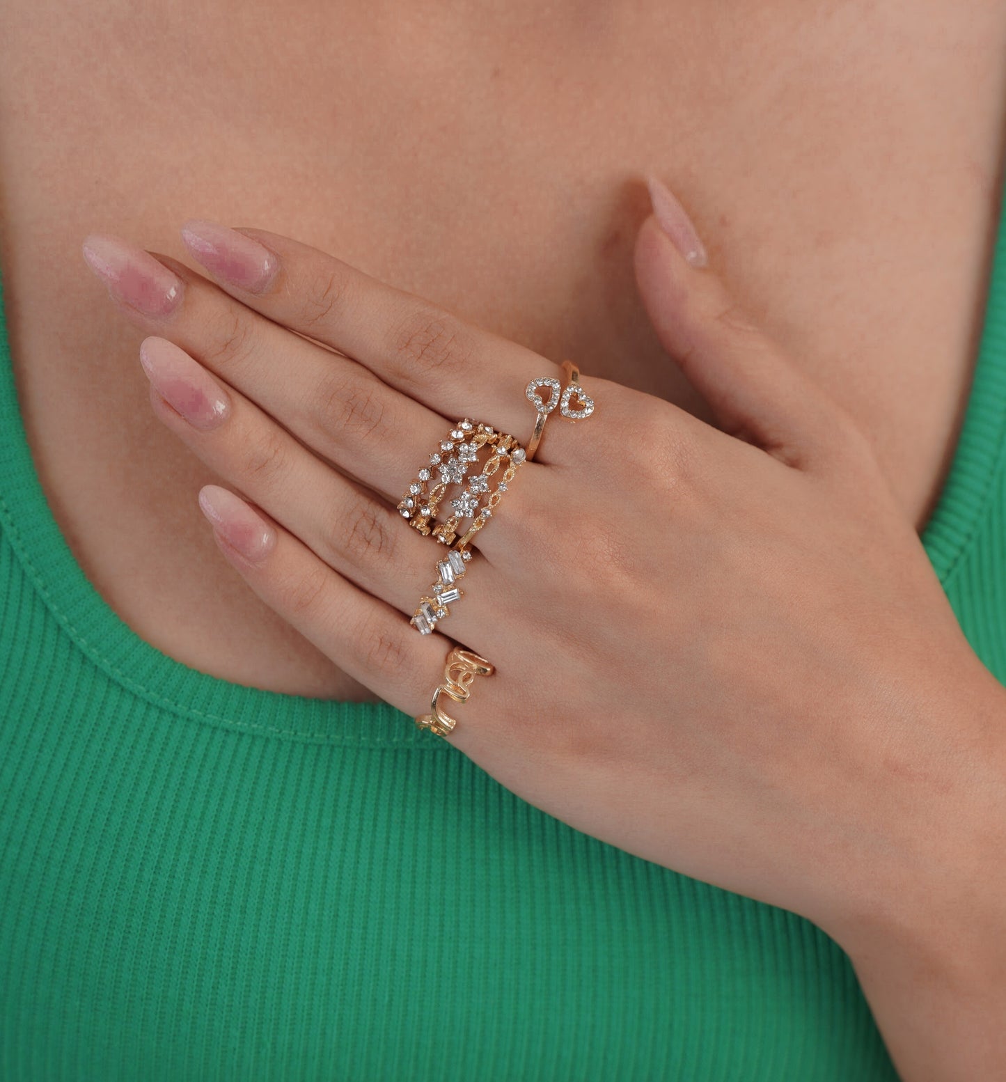 Ring set displayed on hand with green dress – Luxteno Sri Lanka