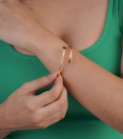 Gold double link bangle bracelet styled with green dress – Luxteno Sri Lanka