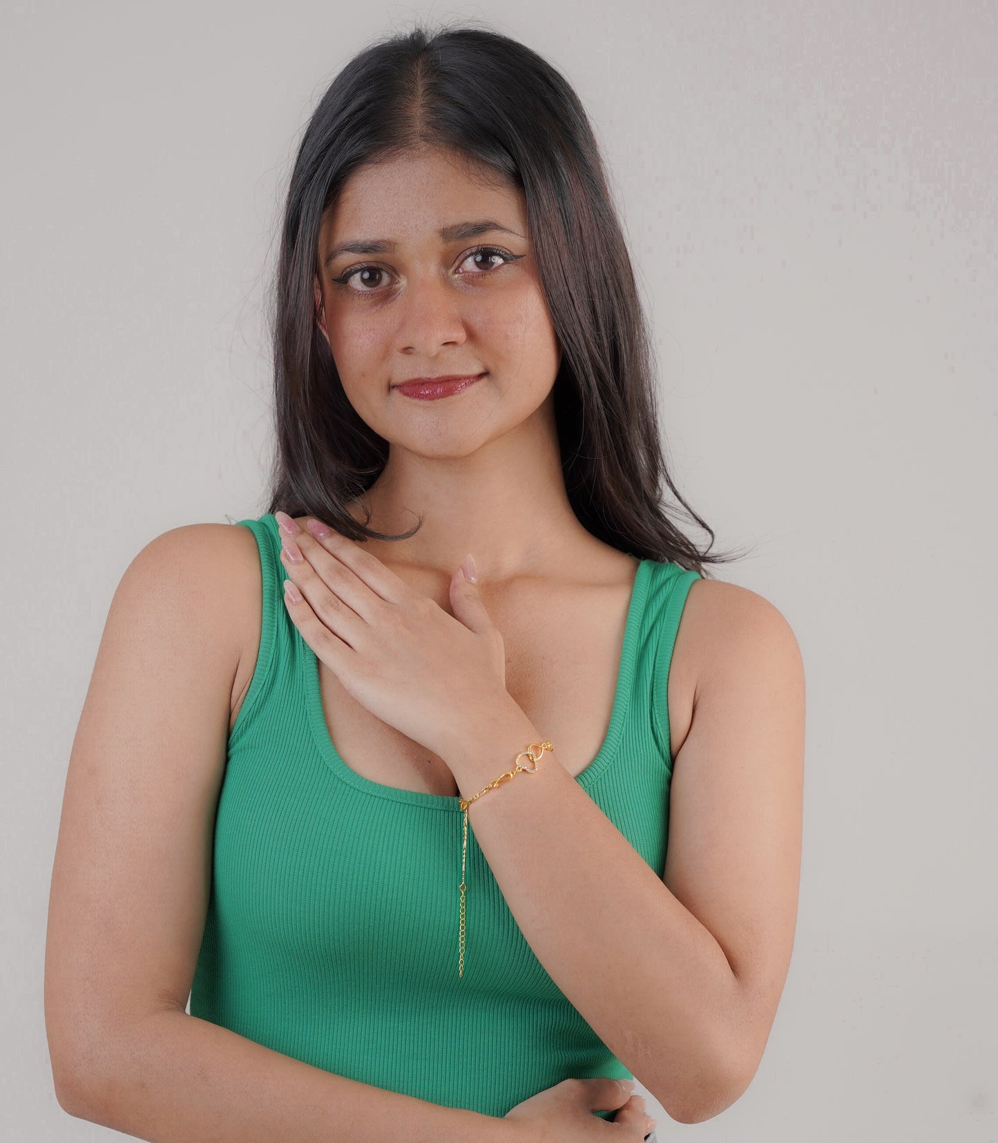 Woman wearing gold love charm bracelet – Luxteno Sri Lanka