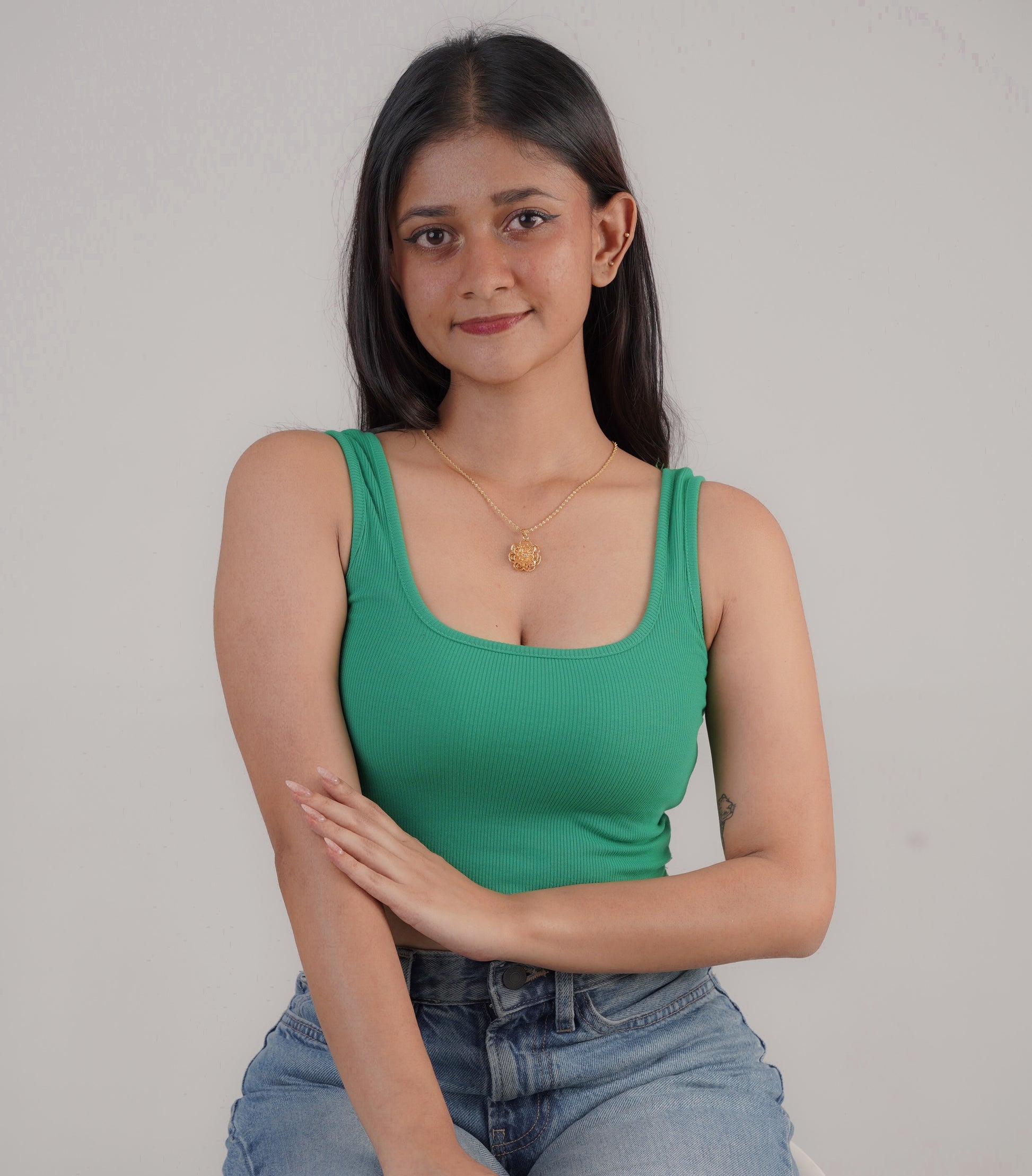 Gold peacock necklace on neck with green dress – Luxteno Sri Lanka