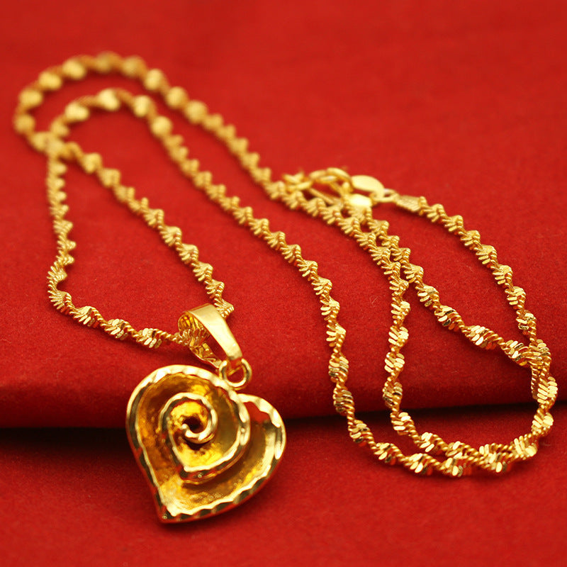 Gold love leaf pendant necklace shown on flat lay – Sri Lanka jewellery