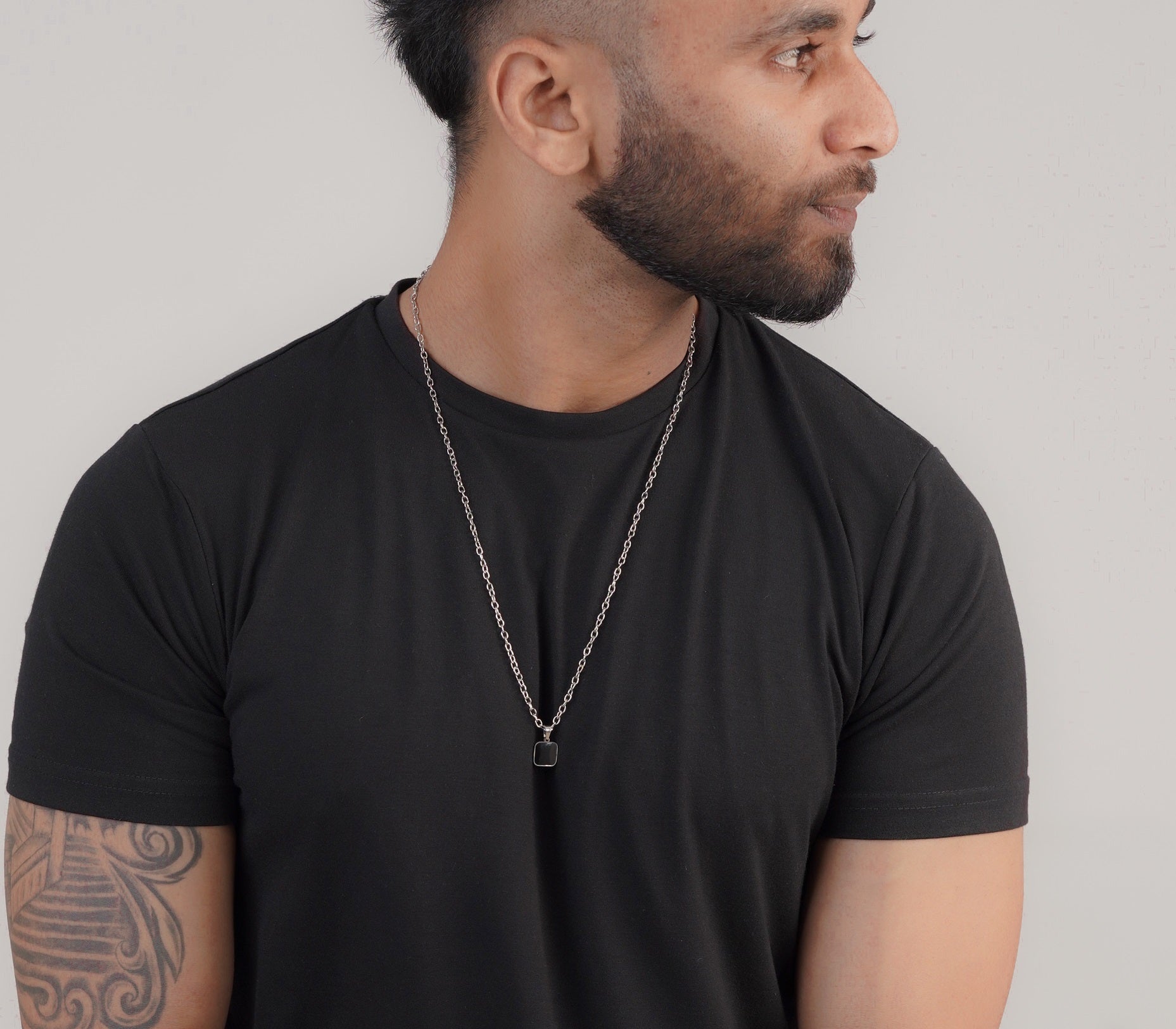 Men's black pendant necklace styled with black t-shirt – Luxteno Sri Lanka