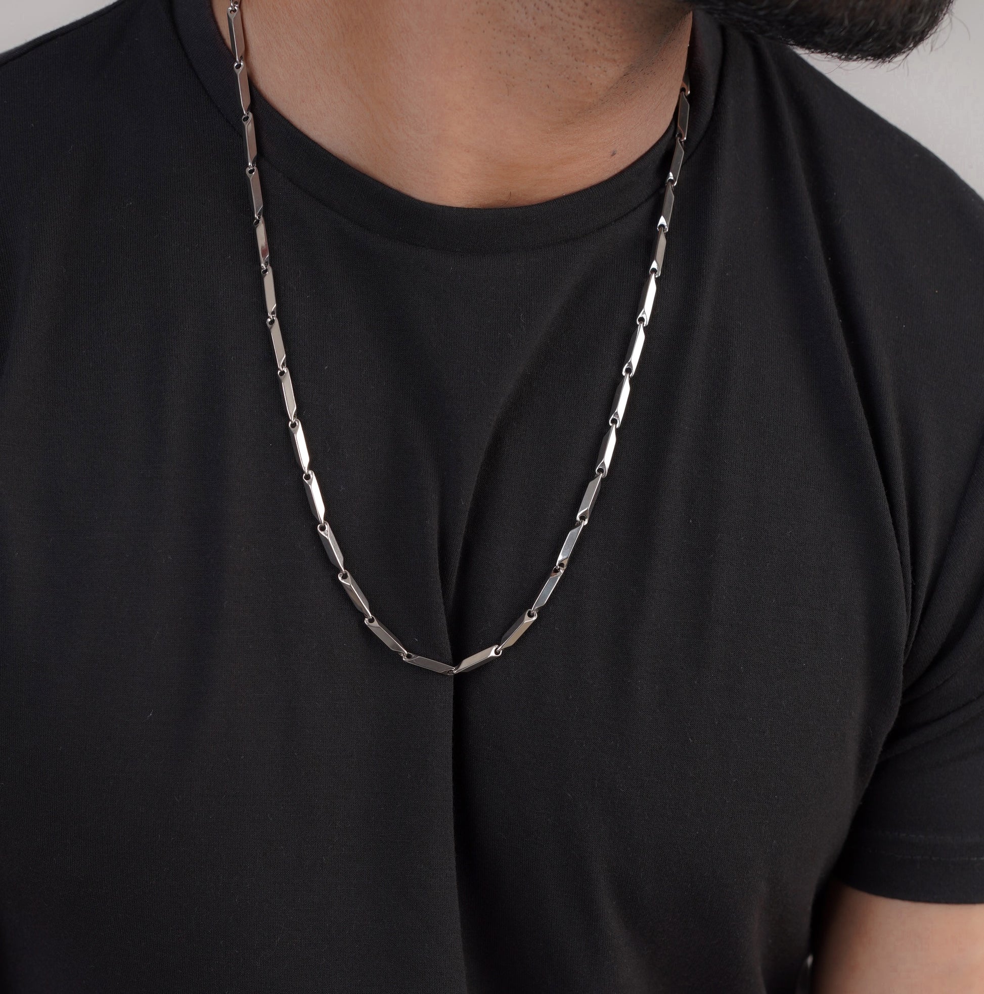 Close-up of men's silver snake chain necklace on neck – Sri Lanka jewellery