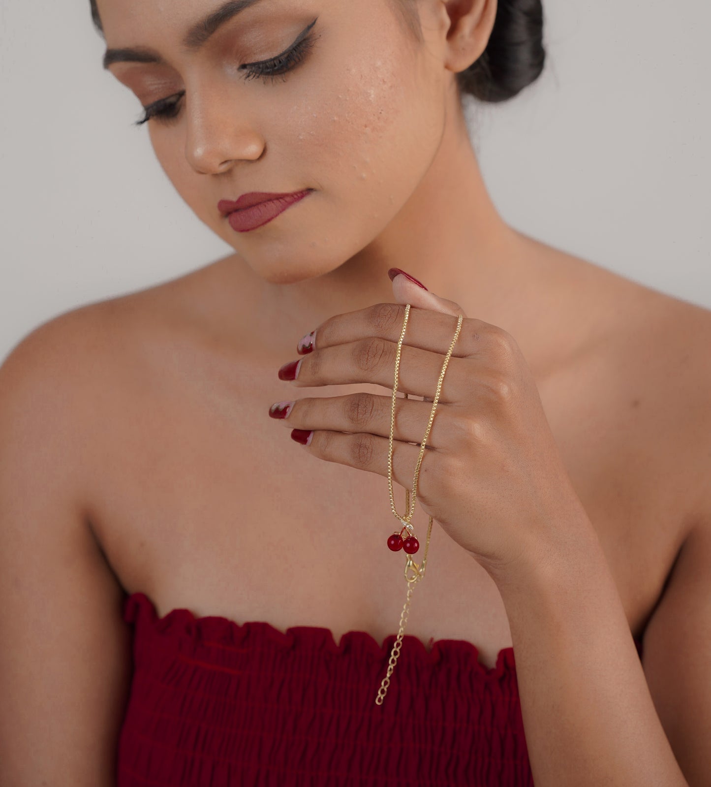 Close-up of red cherry heart pendant on 22k gold chain – Sri Lanka jewellery