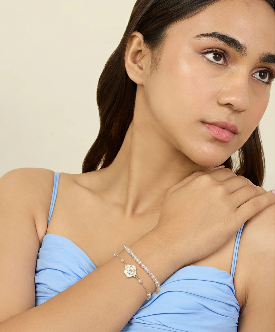 Woman wearing silver pearl bracelet with blue top – Luxteno Sri Lanka