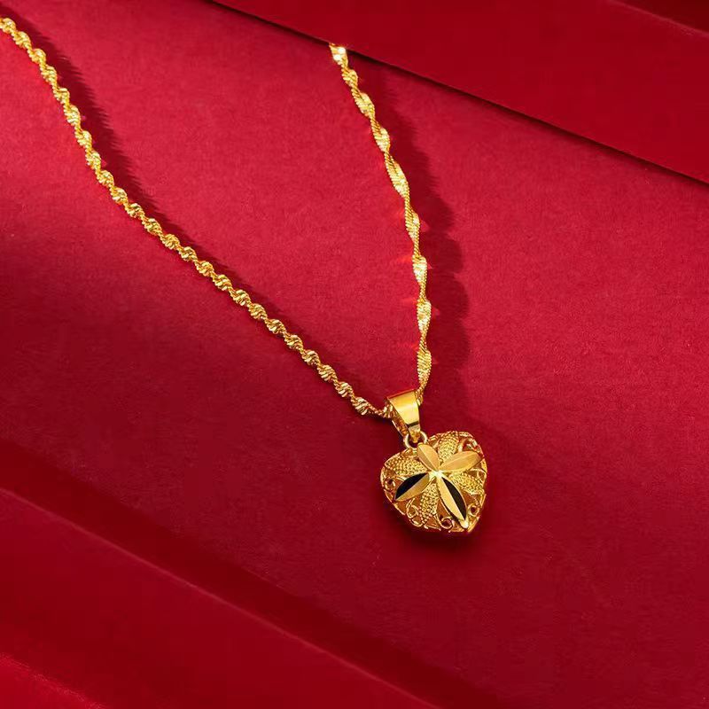 Gold water wave heart pendant necklace displayed on stand – Sri Lanka jewellery
