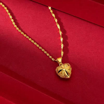 Gold water wave heart pendant necklace displayed on stand – Sri Lanka jewellery