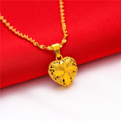 Gold water wave heart pendant necklace displayed on stand 2 – Sri Lanka jewellery